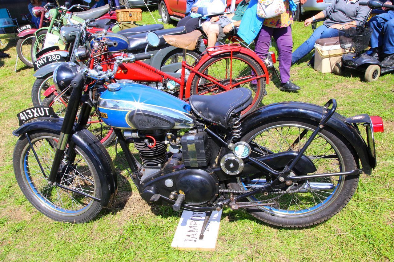 BICYCLES PARKED IN FIELD