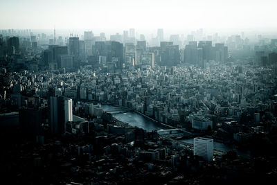 Aerial view of cityscape against sky