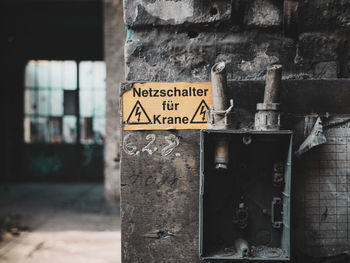 Close-up of sign on wall