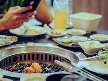 Cropped image of person preparing food