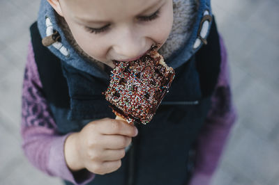 Close-up of cute boy eating waffle