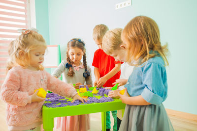 Cute kids playing at classroom