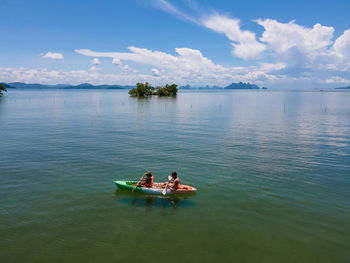 Men canoeing in lake