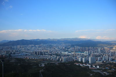 High angle view of buildings in city against sky