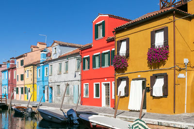 Low angle view of buildings against blue sky