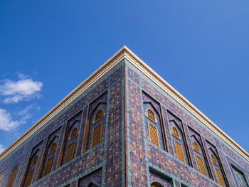 Low angle view of building against blue sky