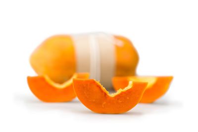 Close-up of orange pumpkin against white background