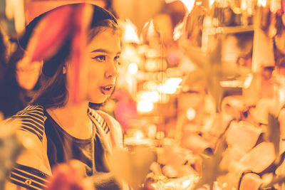 Portrait of smiling young woman in restaurant