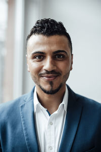 Businessman with black hair in office