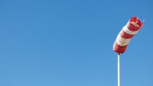 Close-up of ice cream against clear blue sky