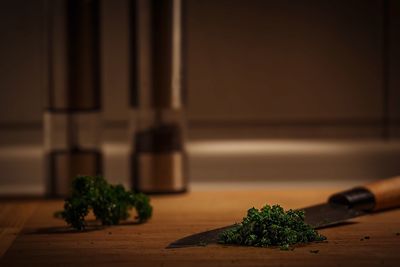 Close-up of vegetables and knife on cutting board