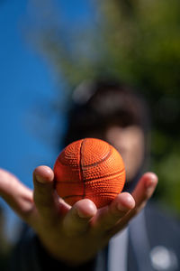 Close-up of hand holding ball