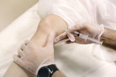 Midsection of hands working