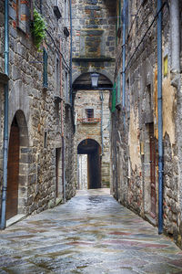 Narrow alley along old building