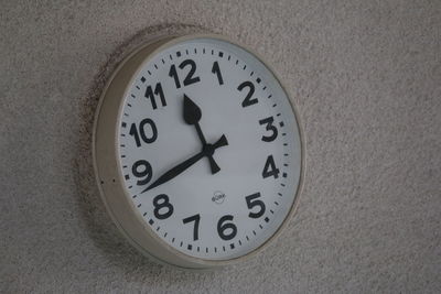 Close-up of clock on wall