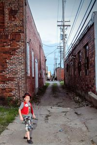 Boy standing on footpath