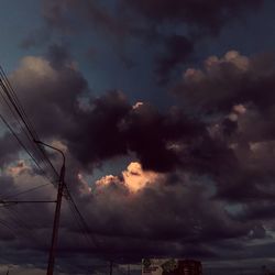 Low angle view of cables against sky