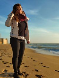 Portrait of woman standing on beach