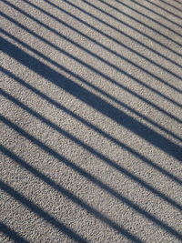 High angle view of shadow on asphalt 