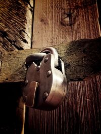 Close-up of door handle on wood