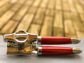 Close-up of red equipment on table