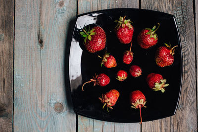 High angle view of strawberries in bowl on table