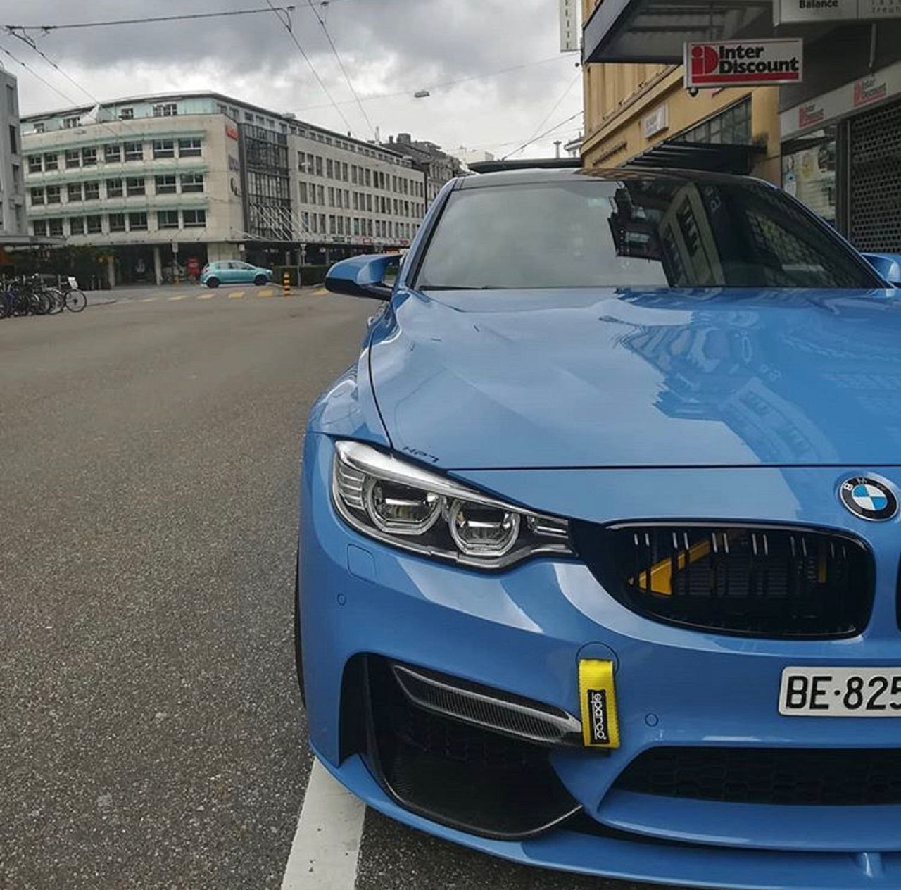 CAR PARKED ON ROAD IN CITY