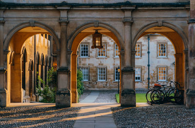 View of peterhouse cambridge arches through the college gate