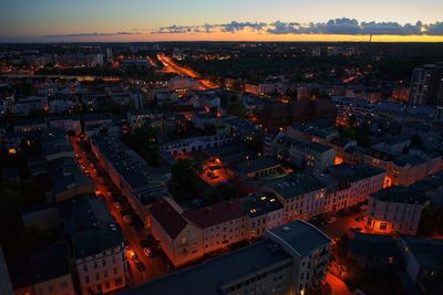 High angle view of illuminated buildings in city at night