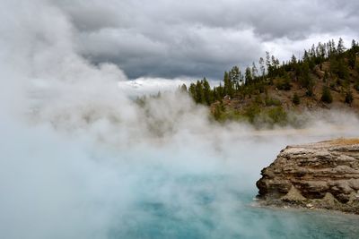 Scenic view of clouds over landscape against sky