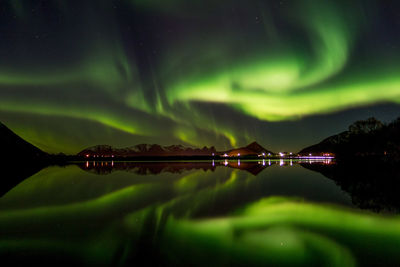 Scenic view of river against sky at night