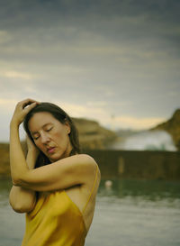 Woman with yellow dress on the basque-french coast iv