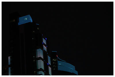 Low angle view of modern building at night