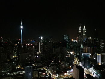 Illuminated buildings in city at night