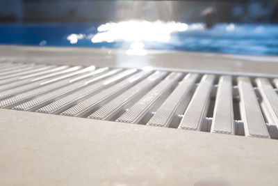 Close-up of table by swimming pool