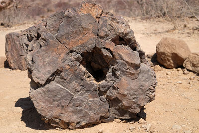 Close-up of rock on sand