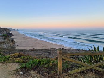 Scenic view of sea against sky during sunset