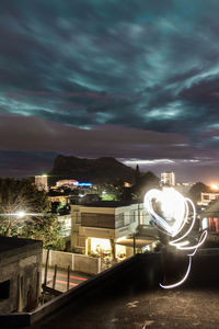 Light trails against sky at night