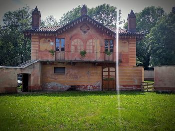 House on field against sky