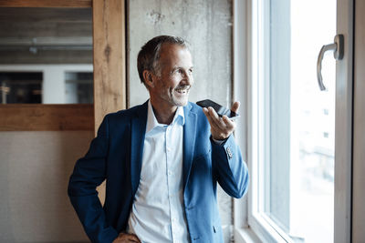 Man standing by window