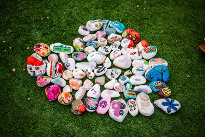 High angle view of multi colored toys on field