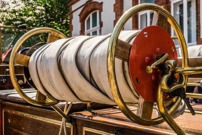 Rolled up hose of a historical fire engine of the fire brigade at an oldtimer exhibition