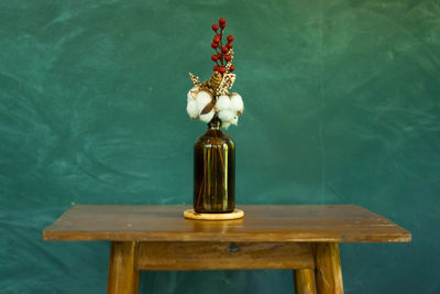 Lamp on table by chair