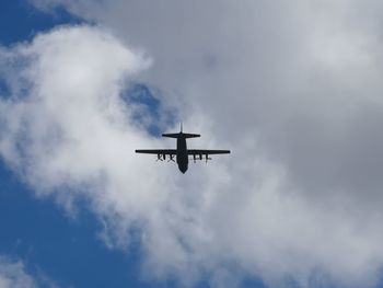 Low angle view of airplane against sky