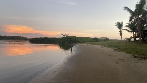 Scenic view of beach against sky during sunset