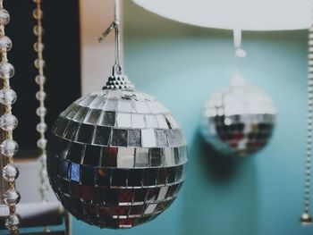 Close-up of crystal decorations hanging at home