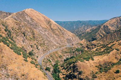 Scenic view of mountains against clear blue sky