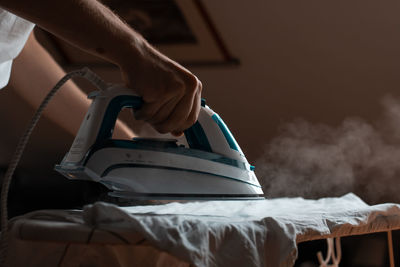 Midsection of man reading book