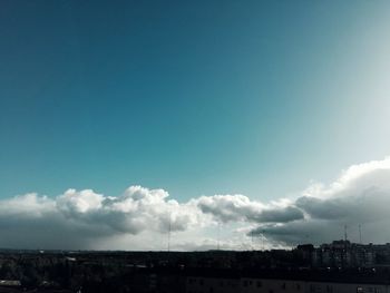 Buildings against cloudy sky