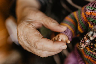 Close-up of man holding hand